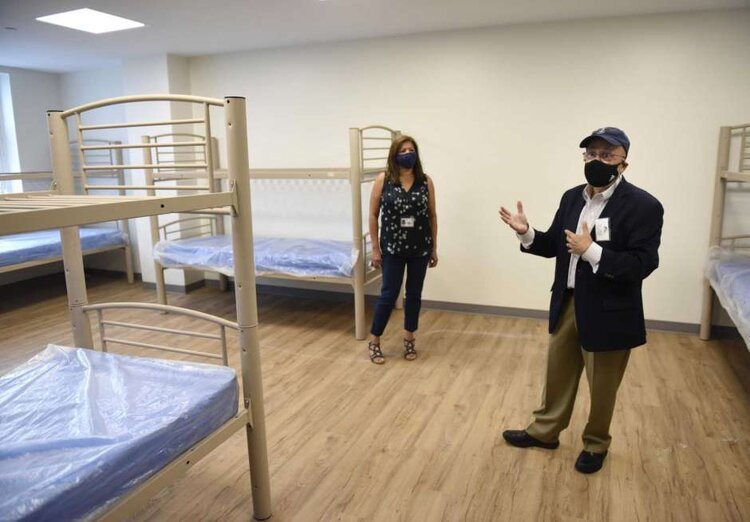  Pacific House Executive Director Rafael Pagan Jr., right, and Connecticut Department of Housing Commissioner Seila Mosquera-Bruno lead a tour of the newly-renovated building in Stamford, Conn. Monday, Sept. 29, 2020. The men's emergency shelter held a ribbon cutting Tuesday for its facility that is finishing up a complete interior renovation. Photo: Tyler Sizemore / Hearst Connecticut Media 