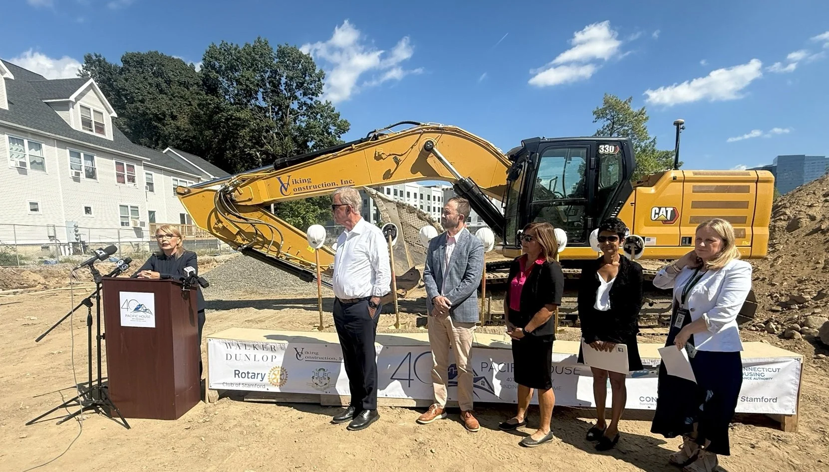 Pacific House CEO & President Carmen Colón speaks to a crowd of supporters who helped to make the Rotary Commons development possible.